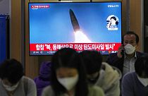 A TV screen shows a file image of North Korea's missile launch during a news program at the Seoul Railway Station in Seoul, South Korea, Thursday, Sept. 29, 2022.