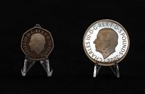 Two new coins bearing official coinage portrait of King Charles III