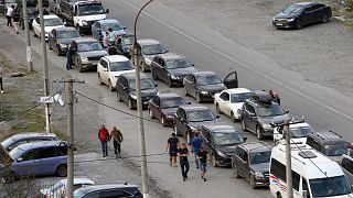 Cars queuing toward the border crossing at Verkhny Lars between Russia and Georgia, leaving Chmi, North Ossetia - Alania Republic, in Russia, Sept. 29, 2022.