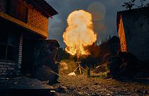 Ukrainian soldiers fire a missile. 