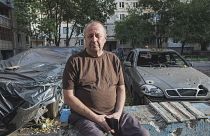 Volodymyr sits amid the aftermath of the explosions near his flat in Mykolaiv, Ukraine. October 1, 2022