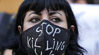 An activist wears a message on her protective face mask "Stop Killing Us" during a protest against the death of Iranian Mahsa Amini in Iran, in Beirut, Lebanon, 2 Oct, 2022.
