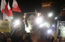 Protestors hold up a pictures of slain journalist Daphne Caruana Galizia during a demonstration outside Malta's prime minister's office in Valletta, Malta, 2019