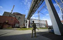 Russian soldier stands guard at the Zaporizhzhia nuclear power plant