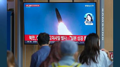 A TV screen showing a news program reporting about North Korea's missile launch with file footage, is seen at the Seoul Railway Station in Seoul, South Korea, Tuesday, Oct. 4