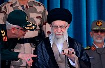Supreme Leader Ayatollah Ali Khamenei, center, listens to chief of the General Staff of the Armed Forces Gen. Mohammad Hossein Bagheri