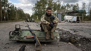 A Ukrainian serviceman pictured in the recently recaptured town of Lyman.
