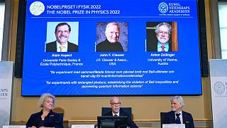 Secretary General of the Royal Swedish Academy of Sciences Hans Ellegren, centre, Eva Olsson, left and Thors Hans Hansson, members of the Nobel Committee for Physics