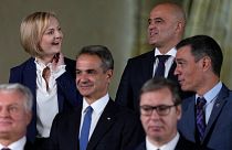 British PM Liz Truss, top left, speaks with North Macedonia's PM Dimitar Kovacevski, top right, at a group photo during a meeting of the European Political Community