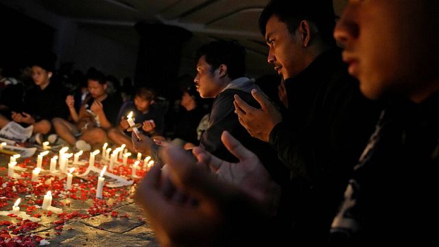 Indonesians hold mass prayer after deadly stadium stampede