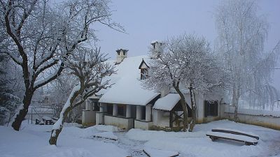 The main house in winter covered with snow. 