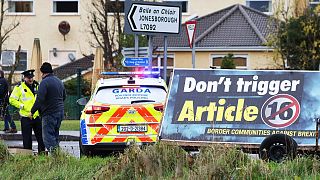 Irish police set up a checkpoint on the border between Ireland and Northern Ireland as Border Communities Against Brexit protest at Carrickcarnon, Ireland, Nov. 20, 2021.