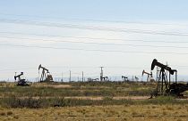 Нефтяные вышки на месторождении в Новой Мексике