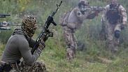 Volunteer soldiers attend a training outside Kyiv, Ukraine, Saturday, Aug. 27, 2022.
