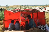 An internally displaced flood-affected family take refuge in a Pakistani refugee camp  on September 28, 2022.