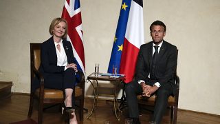 UK Prime Minister Liz Truss and French President Emmanuel Macron meet on the sidelines of the European Political Community meeting in Prague, Czech Republic, Oct 6, 2022.