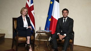 UK Prime Minister Liz Truss and French President Emmanuel Macron meet on the sidelines of the European Political Community meeting in Prague, Czech Republic, Oct 6, 2022. 