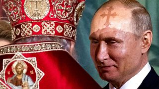 Russian Orthodox Patriarch Kirill talks to President Vladimir Putin