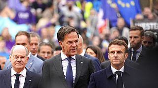 Germany's Chancellor Olaf Scholz, Netherland's Prime Minister Mark Rutte and French President Emmanuel Macron arrive for an EU Summit at Prague Castle in Prague