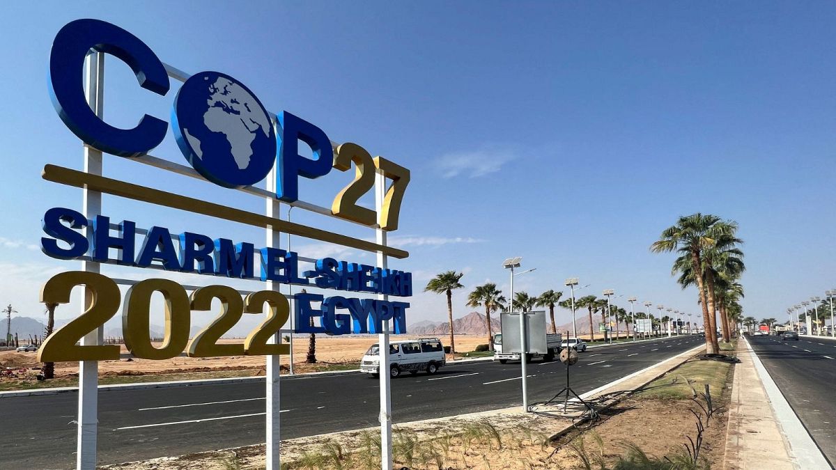 View of a COP27 sign on the road leading to the conference area in Egypt's Red Sea resort of Sharm el-Sheikh town.