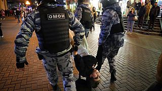Riot police detain a demonstrator during a protest against Russian mobilisation in Moscow in September.