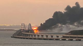 A view shows a fire on the Kerch bridge at sunrise in the Kerch Strait, Crimea, October 8, 2022