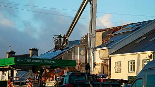 Emergency services work at the scene of an explosion at Applegreen service station in the village of Creeslough in Co Donegal, Ireland, Saturday, Oct. 8, 2022