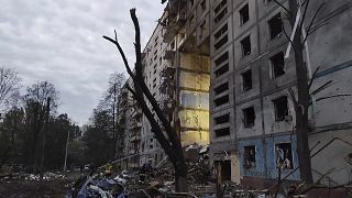 Rescuers work at the scene of a building damaged by shelling in Zaporizhzhia, Ukraine, Sunday, Oct. 9, 2022. 