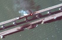 Satellite image shows 11:01 AM local time Saturday Oct 8, 2022 of the aftermath of the explosion that damaged the Kerch bridge