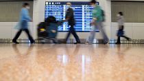 Des voyageurs dans l'aéroport international de Tokyo-Haneda alors que le Japon assouplit ses restrictions frontalières - 11.10.2022 