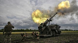 Ukrainian servicemen fire with a French self-propelled 155 mm/52-calibre gun Caesar towards Russian positions in the eastern Ukrainian Donbas region, June 15, 2022.