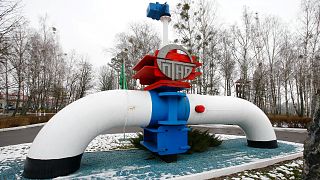 A model of a pipe line is seen at the main entrance to the Gomel Transneft oil pumping station, which moves crude through the Northern Druzhba pipeline westwards to Poland