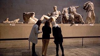 A statue thought to represent Greek god Dionysos, from the east pediment of the Parthenon, at an exhibition on ancient Greek art, at the British Museum, London, Jan. 8, 2015.