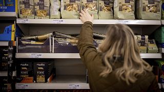 A customer shops for pasta at a Sainsbury's supermarket in Walthamstow, east London in February 2022