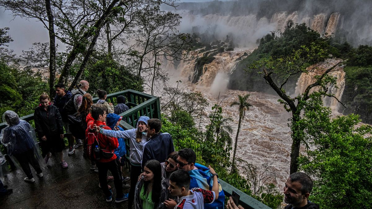Tourists visit the Iguazu falls from the Brazilian side on the border with Argentina.