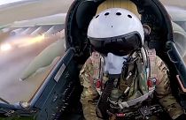 A Russian air force pilot is seen in the cockpit of his Su-25 as it flies on a mission in Ukraine.