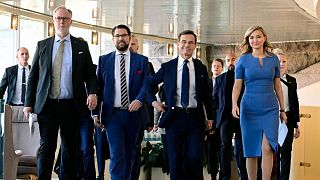 The leaders of four parties which will form the new government of Sweden, at the Parliament in Stockholm, Sweden, Friday Oct. 14, 2022.