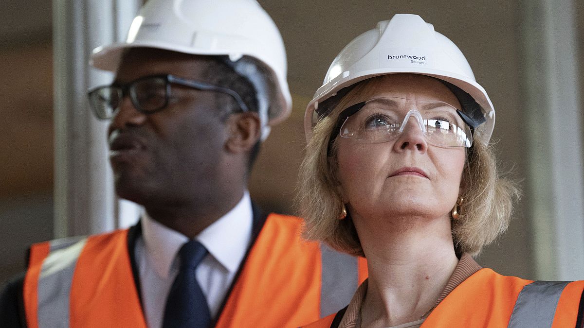 Britain's Prime Minister Liz Truss and finance minister Kwasi Kwarteng at a construction site during the Conservative Party conference, Birmingham, Tuesday, Oct. 4, 2022.