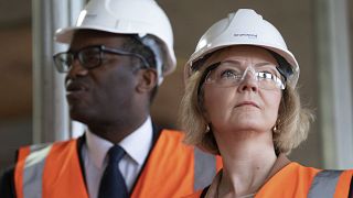 Britain's Prime Minister Liz Truss and finance minister Kwasi Kwarteng at a construction site during the Conservative Party conference, Birmingham, Tuesday, Oct. 4, 2022.