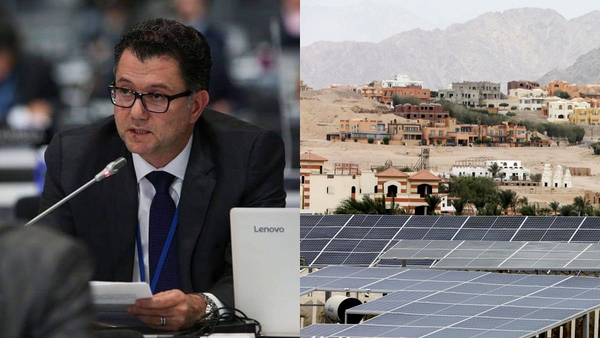 Ambassador Mohamed Nasr, alongside a view of solar panels on a hotel rooftop in Sharm el-Sheikh. The resort town is turning to clean energy in the run up to COP27.