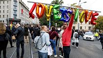 People gather to join a rally of thousands in Bratislava, Slovakia in 2022, to honour two gay men who were shot dead in the capital 