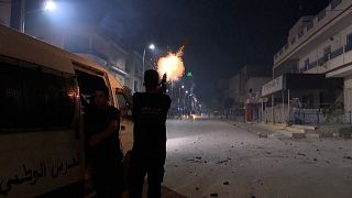 Tunisian security forces fire tear gas at protesters during clashes after the death of a young man injured in a chase