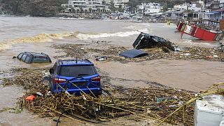 Cars submerged in water, following heavy thunderstorms, in the village of Agia Pelagia, on the island of Crete, 15 October 2022