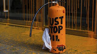 A fire extinguisher filled with paint and used to spray orange paint on the window shop of the Aston Martin car show room on 16 October 2022