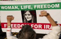 Demonstrators chant slogans while marching during the "March of Solidarity for Iran" in Washington, DC.