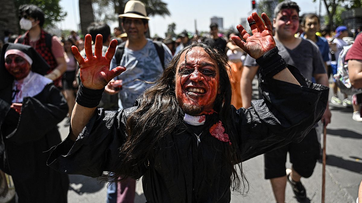 Revellers in costume take part in the traditional Zombie Parade celebrated ahead of Halloween, in Santiago.