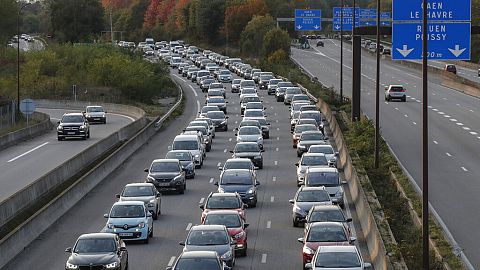 Commuters stuck in a rush-hour traffic jam on the outskirts of Paris