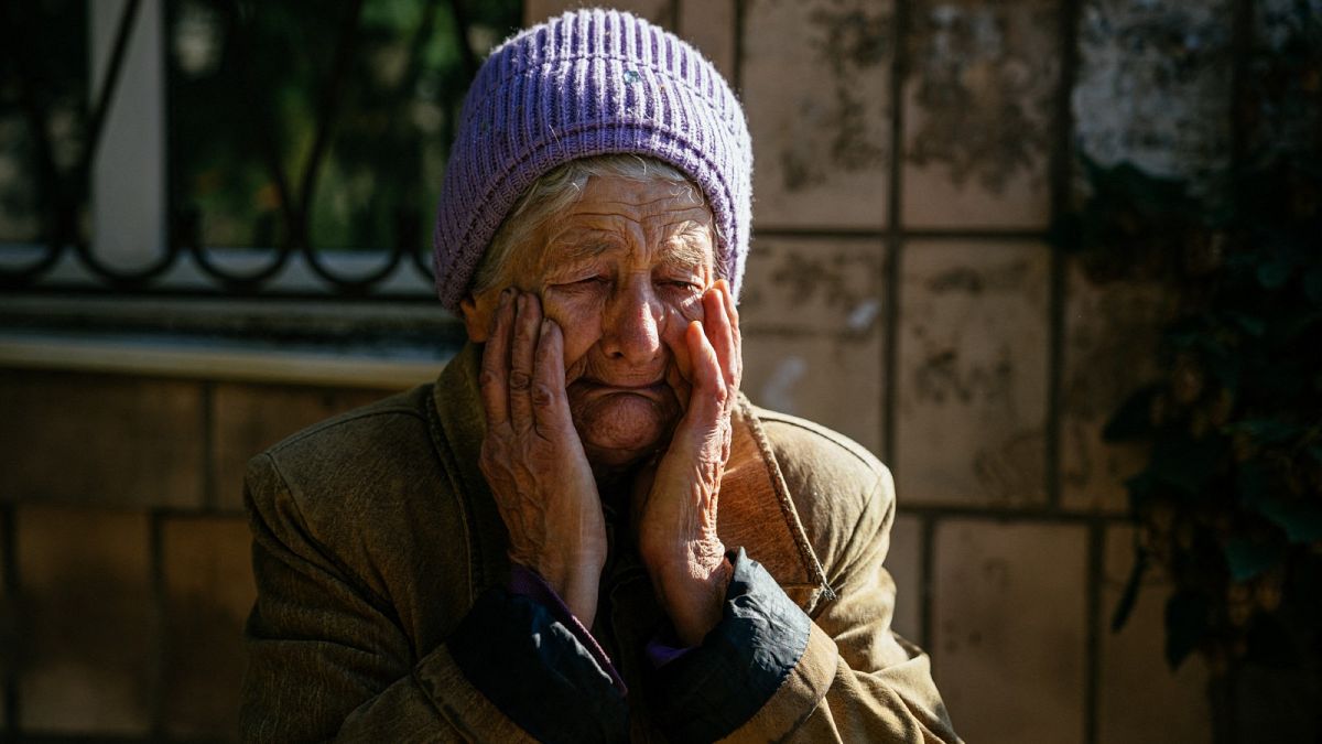 80 year-old Luba reacts during shelling in the town of Bakhmut on October 15, 2022, amid the Russian invasion of Ukraine.