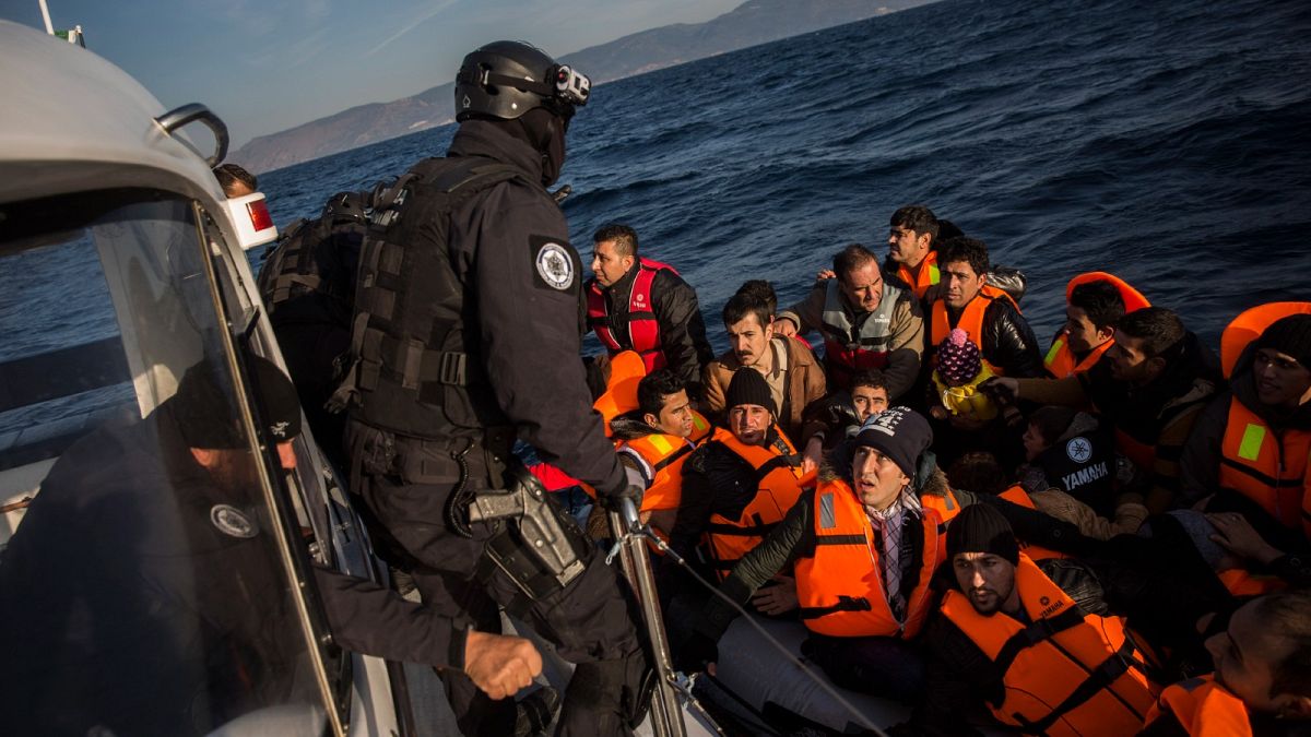 Members of the Frontex from Portugal rescue 56 people who were lost in an open sea as they try to approach on a dinghy the Greek island of Lesbos, on Dec. 8, 2015. 