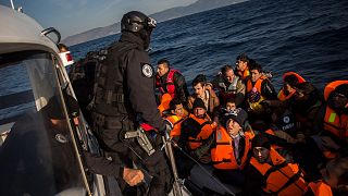 Members of the Frontex from Portugal rescue 56 people who were lost in an open sea as they try to approach on a dinghy the Greek island of Lesbos, on Dec. 8, 2015.